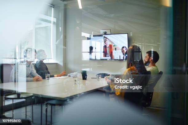 Business People Having A Video Call Stock Photo - Download Image Now - Meeting Room, Office, Working
