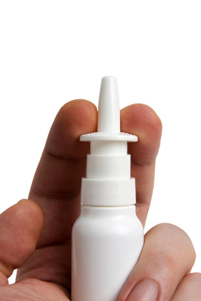 istock Nasal spray in hand. Ready to use. Diluted sea water 1074959760