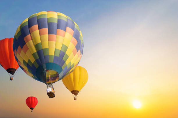 istock Colorful balloons floating in the sky at sunset. 1074960056