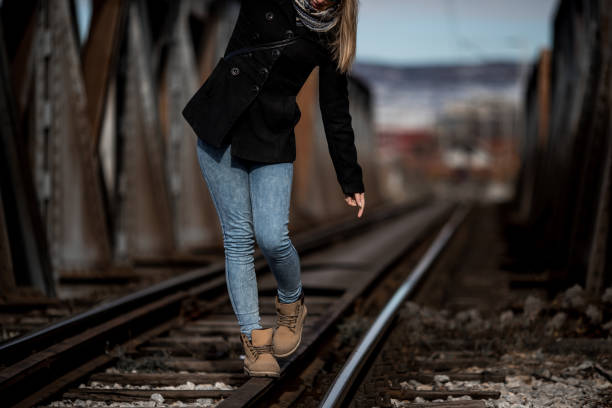 istock Woman on the bridge 1074962230