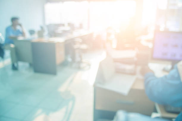 Businessmen blur in the workplace or work space of table in office room with computer or shallow depth of focus of abstract background. Business blur interior in hospital have modern commercial hall.