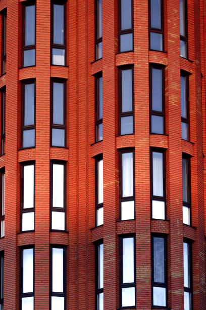 istock Facade of a red multi-storey building. Fragment. 1074966120