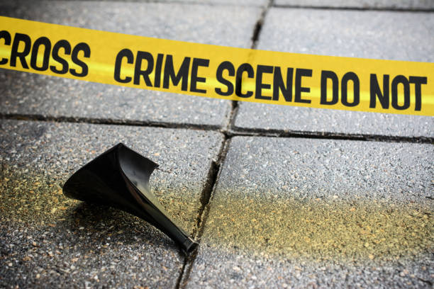 istock Cordon tape crime scene over broken stiletto heel 1074967122