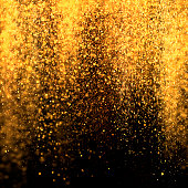 Gold sparkling dust falling from the sky