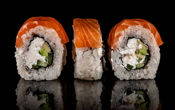 istock Three pieces of sushi rolls Philadelphia 1074974840