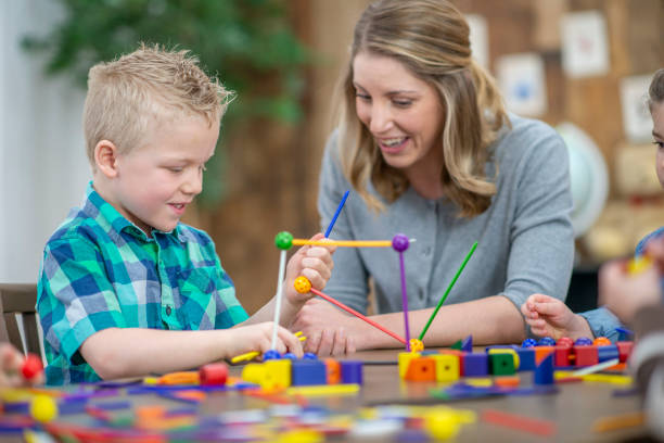 istock Teacher and student building together 1074980344