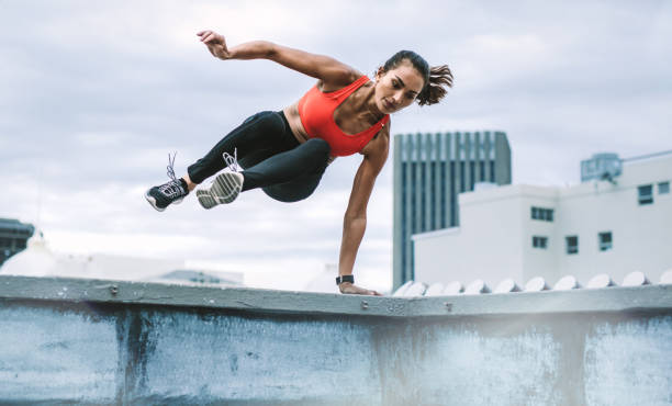 istock Fitness woman doing workout on rooftop 1074981152