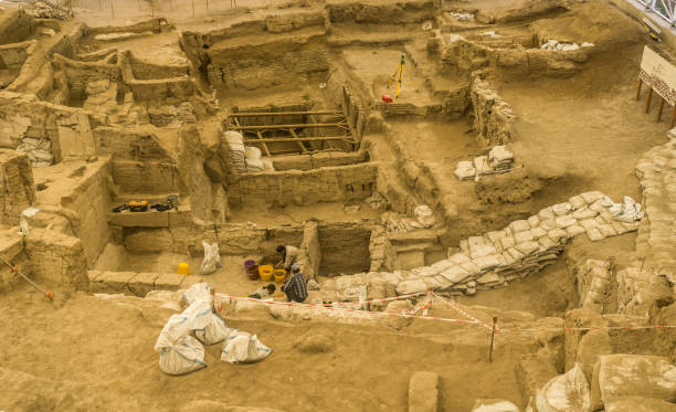 Catalhoyuk(Çatalhöyük) Ancient city from inside. Cumra, Konya/Turkey June 1 2016: Catalhoyuk Ancient City. Built in 7500 B.C. Catalhoyuk is the oldest settlement in the world. (Neolithic and Chalcolithic period) Archaeologist work in area. çatalhöyük stock pictures, royalty-free photos & images