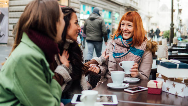 istock Girls having coffee together 1074985820