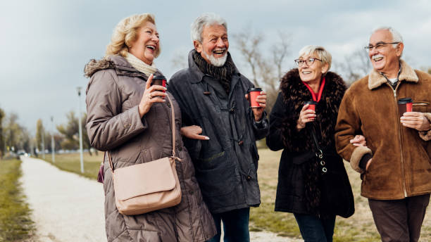 istock Senior couples having a walk outdoors 1074995224