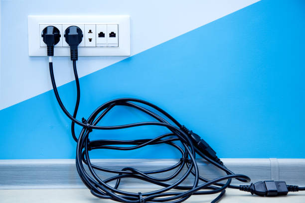 istock multiple outlet with a pile of black cable. 1074996998