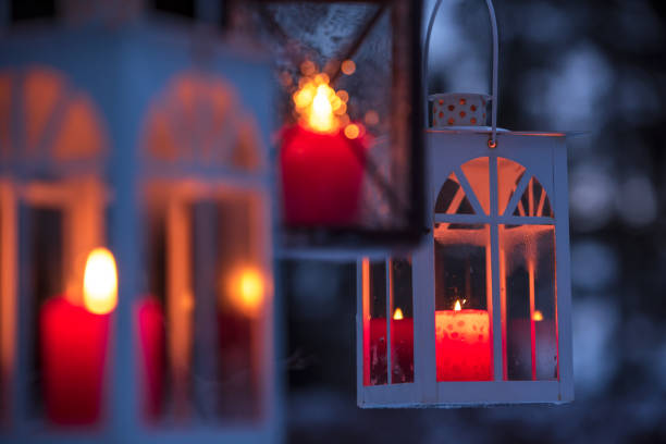 Lanterns hanging from tree branches. Selective focus and shallow depth of field.