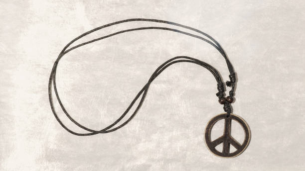 istock Necklace with wooden peace symbol. Make love Not War. Applied flat 1075005774