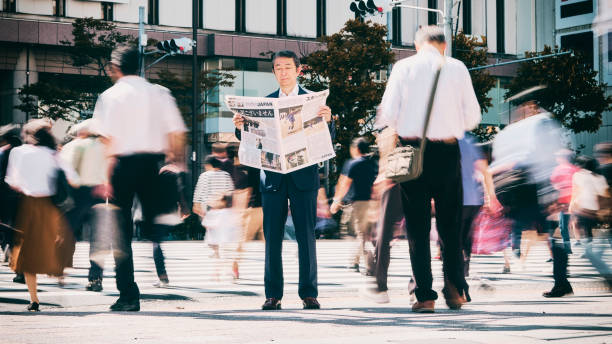 Japanese Businessman with Newspaper