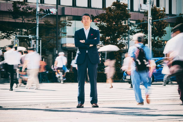 istock Japanese Businessman with Newspaper 1075010898