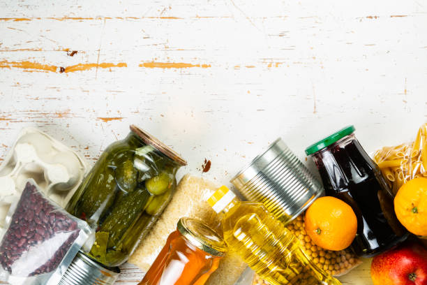 istock Food donations in box in kitchen background 1075011078