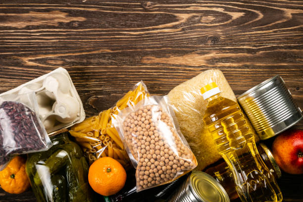 istock Food donations in box in kitchen background 1075011178