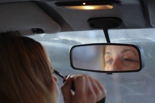istock Woman make up in the car 1075023550
