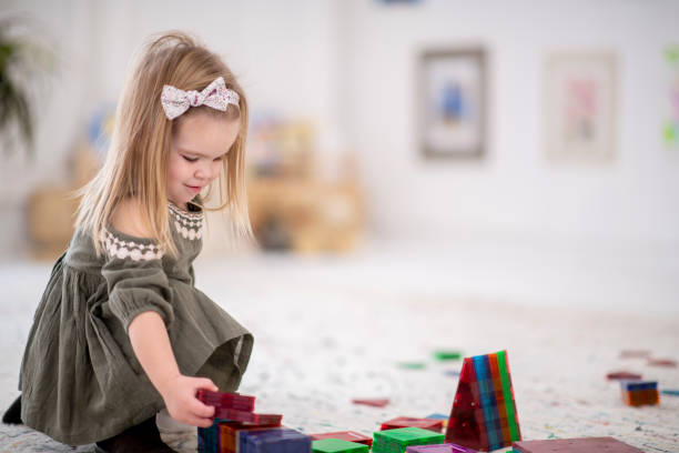 istock Little girl playing 1075024374