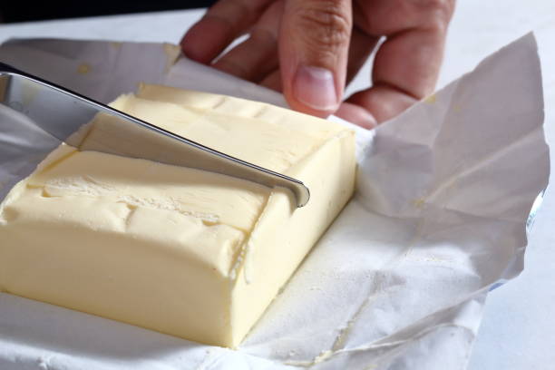 istock Cutting Butter Block in Half. Making Treacle Pie Series. 1075024452