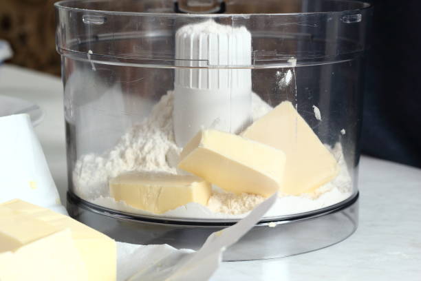 istock Diced Butter with Flour in Mixer Cup. Making Treacle Pie Series. 1075024638