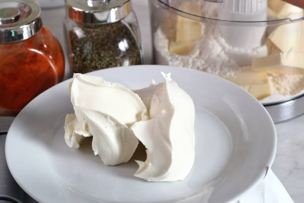istock Weighing Cream Cheese Mascarpone. Making Treacle Pie Series. 1075024770