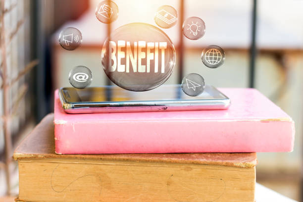 istock benefit concept in transparent bubbles with black phone above book 1075028160