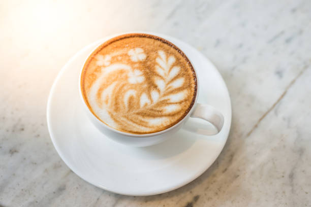istock A cup of coffee with beautiful leaf latte art. 1075030676