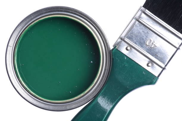 istock Green paint can with brush 1075032614