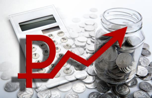 istock rising ruble diagram and calculator and russian ruble coins 1075033152