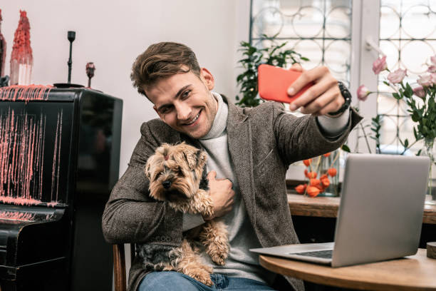 istock Man making a selfie with his dog 1075041276