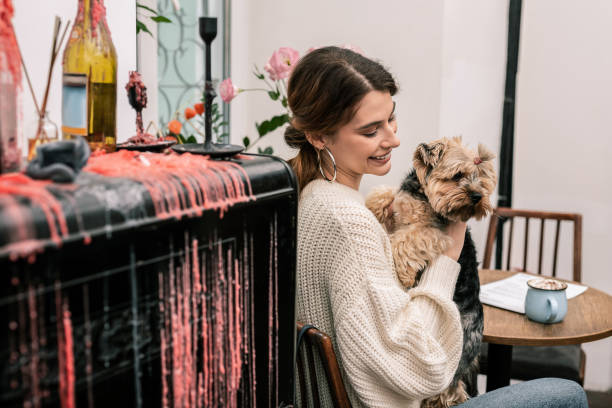istock Smiling mistress holding her funny small dog 1075041374