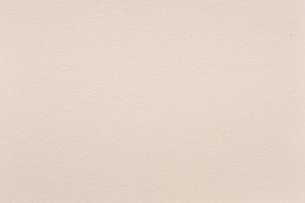 istock Natural high quality beige paper texture on macro. 1075043500