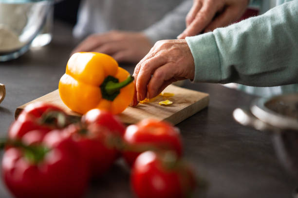 istock Woman preparing salad 1075052470