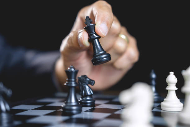 istock Businessman playing chess and thinking strategy about crash overthrow the opposite team and development analysis for win and successful 1075057264
