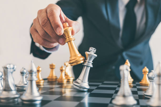 istock Businessman leadership playing chess and thinking strategy plan about crash overthrow the opposite team and development analyze for successful of corporate 1075057324