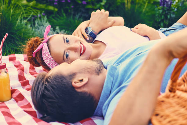 istock Couple on a picnic in a park. 1075057486