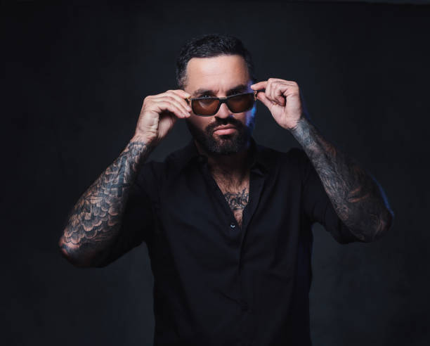 istock A man with tattoos on arms and neck. 1075065392