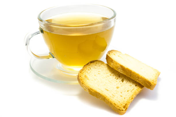 Tea with rusk isolated on white background