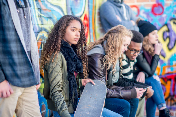 istock Friends sitting outside 1075069966