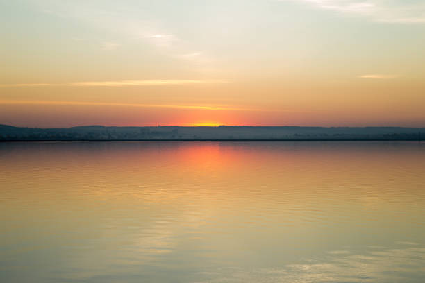 istock Beautiful red sunset over lake 1075072248