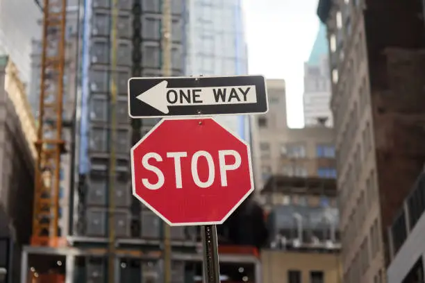 Photo of 'Stop' and 'One way' road signs in New York