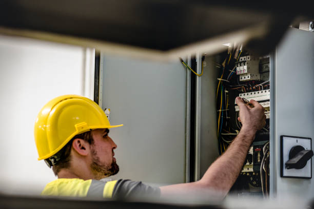 istock Electrician repairing electric panel 1075086126
