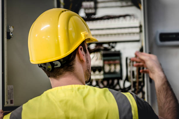 istock Electrician repairing electric panel 1075086140