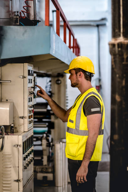 istock Electrician repairing electric panel on a machine 1075086202