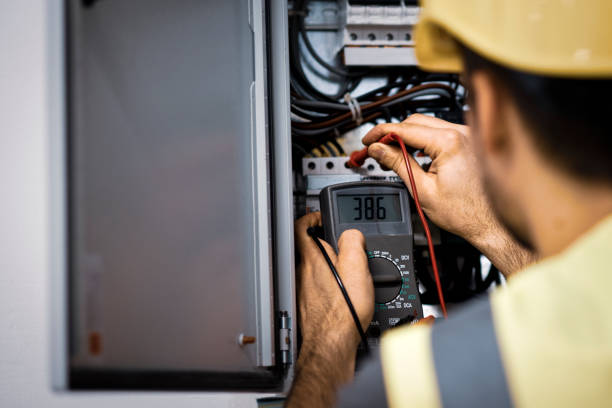istock Electrician repairing electric panel 1075086250