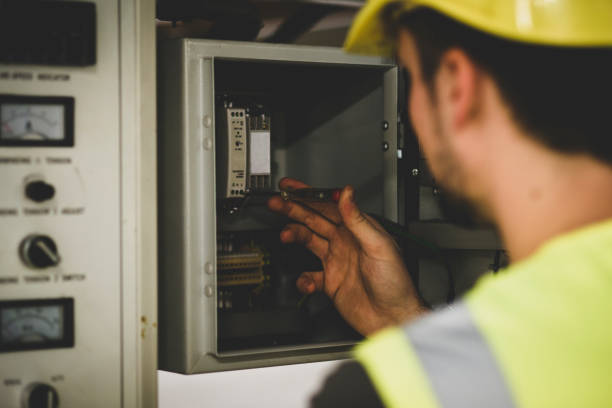 istock Electrician repairing electric panel 1075086270