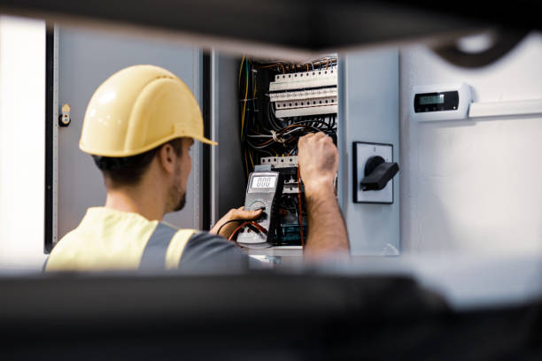 istock Electrician repairing electric panel 1075086274