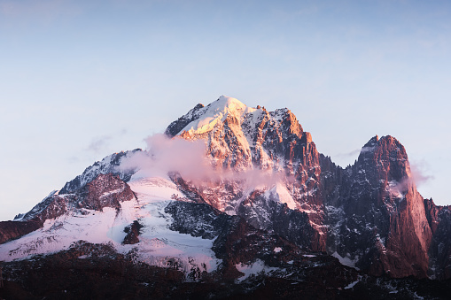 Incredible colorful sunset on Aiguille Verte peak in French Alps