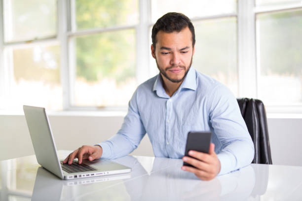 istock mexican attractive businessman on his 30s working at modern home office with computer laptop 1075100716